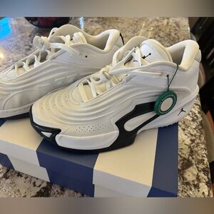 Jordan White and Black Low-Top Sneakers with Green Tag